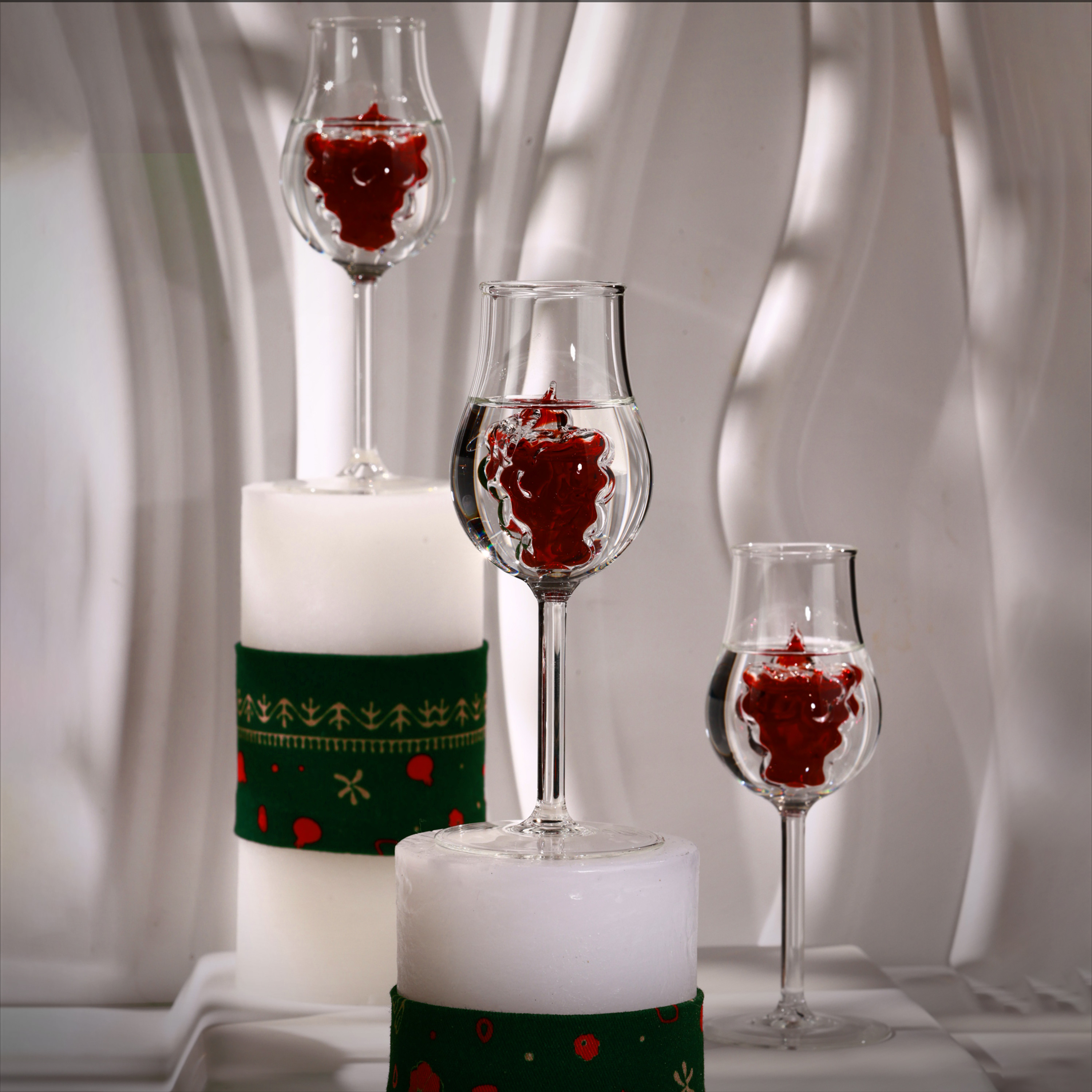 Drinking glass with grape